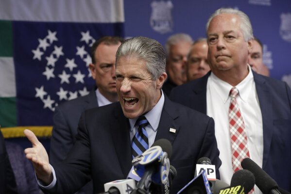 Police Benevolent Associaton President Patrick J. Lynch, left, speaks with NYPD officer Daniel Pantaleo's attorney Stuart London by his side, right, during a press conference at PBA headquarters following a decision to terminate Pantaleo, Monday, Aug. 19, 2019, in New York. Pantaleo was involved in the chokehold death of Eric Garner.  (AP Photo/Kathy Willens)