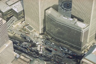 Manhattan's West Street is jammed with police and emergency service vehicles in the aftermath of yesterday's explosion that rocked New York's World Trade Center's twin towers and the Vista Hotel, foreground right, Feb. 27, 1993, causing evacuation of the financial center.  Officials all but confirmed that a bomb caused the huge blast that left at least five people dead and injured hundreds.  (AP Photo/Mike Derer)
