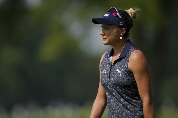 Lexi Thompson walks to the fifth green during the first round of the LPGA Tour Kroger Queen City Championship golf tournament in Cincinnati, Thursday, Sept. 7, 2023. (AP Photo/Aaron Doster)