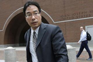FILE - In this Sept. 19, 2017, file photo, Glenn Chin, a supervisory pharmacist at the now-closed New England Compounding Center, leaves federal court after attending the first day of his trial in Boston. Chin, convicted for his role in a deadly 2012 multistate meningitis outbreak, will spend more time behind bars after a federal judge, Wednesday, July 21, 2021, lengthened his original sentence by 2 1/2 years. (AP Photo/Steven Senne, File)