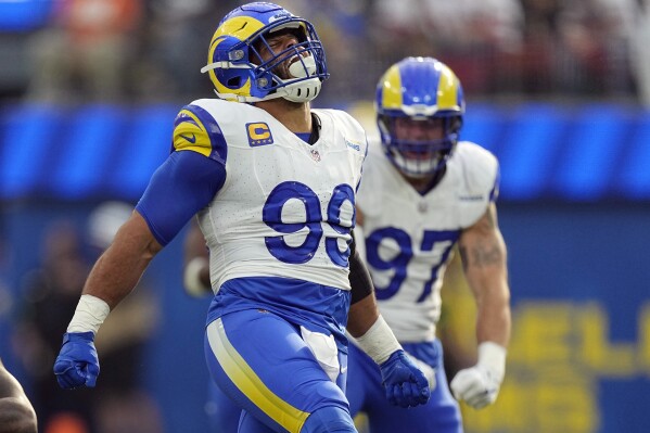 Los Angeles Rams defensive tackle Aaron Donald (99) reacts after a tackle on Cleveland Browns running back Jerome Ford during the first half of an NFL football game Sunday, Dec. 3, 2023, in Inglewood, Calif. (AP Photo/Mark J. Terrill)