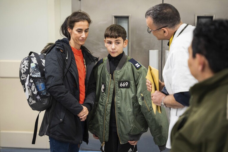 FILE - This photo provided by the Israeli army shows released Israeli hostage Eitan Yahalomi, 12, upon his arrival at Tel Aviv Sourasky Medical Center on Nov. 27, 2023, after being held hostage by Hamas in the Gaza Strip. An Associated Press review of Hamas instruction manuals shows the group planned ahead of time to target civilians. (Israel Defense Forces via AP, File)