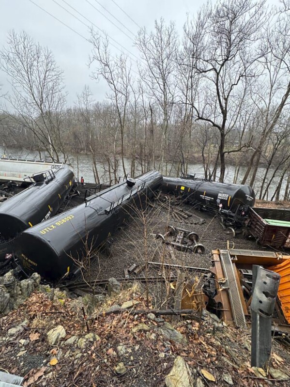 This photo provided by Nancy Run Fire Company shows a train derailment along a riverbank in Saucon Township, Pa., on Saturday, March 2, 2024. Authorities said it was unclear how many cars were involved but no injuries or hazardous materials were reported. (Nancy Run Fire Company via AP)