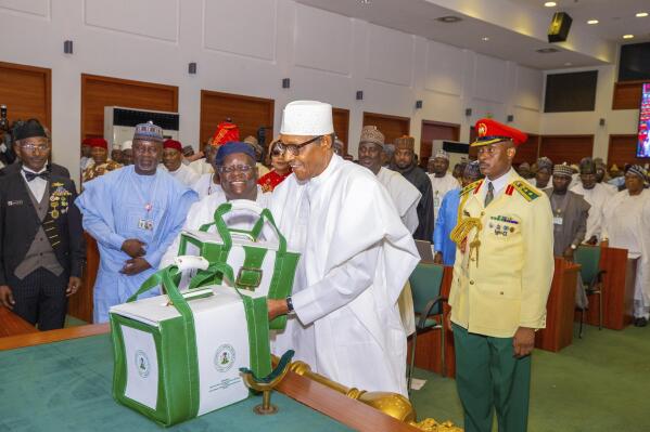 In this photo released by the Nigeria State House, Nigeria's President Muhammadu Buhari attends a budget presentation to the National Assembly in Abuja, Nigeria, Friday, Oct. 7, 2022. Nigerian President Muhammadu Buhari is making a big bet to revive the West African nation’s economy and end its security woes with a record 20.5 trillion naira ($47.3 billion) proposed expenditure plan presented lawmakers in the capital city of Abuja on Friday. (Sunday Aghaeze/Nigeria State House via AP)