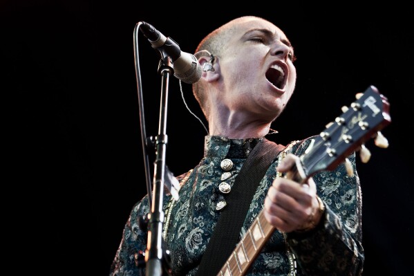 FILE - Irish singer-songwriter Sinéad O'Connor in concert on the first night of the Toender Folk Music Festival in Toender, on the south western part of Denmark on Aug. 23, 2013. O’Connor, the gifted Irish singer-songwriter who became a superstar in her mid-20s but was known as much for her private struggles and provocative actions as for her fierce and expressive music, has died at 56. The singer's family issued a statement reported Wednesday by the BBC and RTE. (AP Photo/Casper Dalhoff, Polfoto, File)