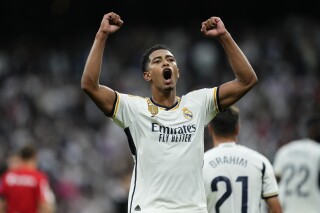 Real Madrid's Jude Bellingham celebrates at the end of Spanish La Liga soccer match between Real Madrid and Getafe at the Santiago Bernabeu stadium in Madrid, Spain, Saturday, Sept. 2, 2023. Real Madrid won 2-1. (AP Photo/Jose Breton)