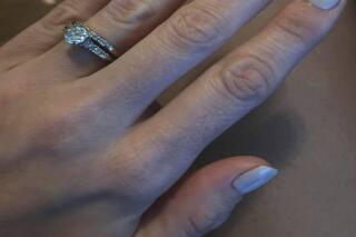 This Sept. 2, 2020, photo provided by Francesca Teal shows her wedding ring in Groveland, Mass., that she feared was lost forever when it slipped off her finger at a New Hampshire beach. A stranger who responded to a Facebook post found the ring using a metal detector. (Francesca Teal via AP)