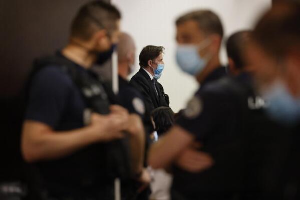 Rémy Daillet-Wiedemann, a former French politician whose popularity grew when he spread QAnon-style conspiracy theories, appears in court in Nancy, France on Wednesday, June 16, 2021, on charges he orchestrated the kidnapping of an 8-year-old girl whose mother had lost custody of her. (AP Photo/Jean-Francois Badias)