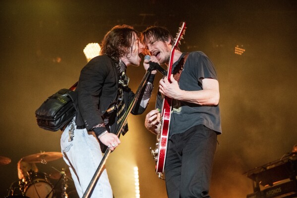 FILE - Matt Shultz, left, and Nick Bockrath of Cage The Elephant perform at the All In Music & Arts Festival on Sept. 4, 2022, in Indianapolis. The band has a new album called "Neon Pill." (Photo by Amy Harris/Invision/AP, File)