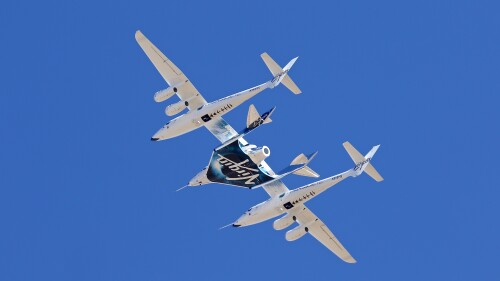 FILE - Virgin Galactic's VSS Unity departs Mojave Air & Space Port in Mojave, Calif., for the final time as Virgin Galactic shifts its SpaceFlight operations to New Mexico, Feb. 13, 2020. Virgin Galactic is aiming for early August 2023 for its next flight to the edge of space, a trip that is expected to include the first of many ticket holders who have been waiting years for their chance at weightlessness aboard the company's rocket-powered plane. (Matt Hartman via AP, File)