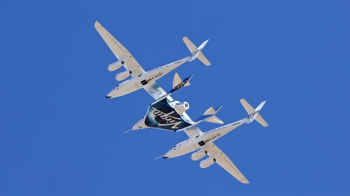 FILE - Virgin Galactic's VSS Unity departs Mojave Air & Space Port in Mojave, Calif., for the final time as Virgin Galactic shifts its SpaceFlight operations to New Mexico, Feb. 13, 2020. Virgin Galactic is aiming for early August 2023 for its next flight to the edge of space, a trip that is expected to include the first of many ticket holders who have been waiting years for their chance at weightlessness aboard the company's rocket-powered plane. (Matt Hartman via AP, File)