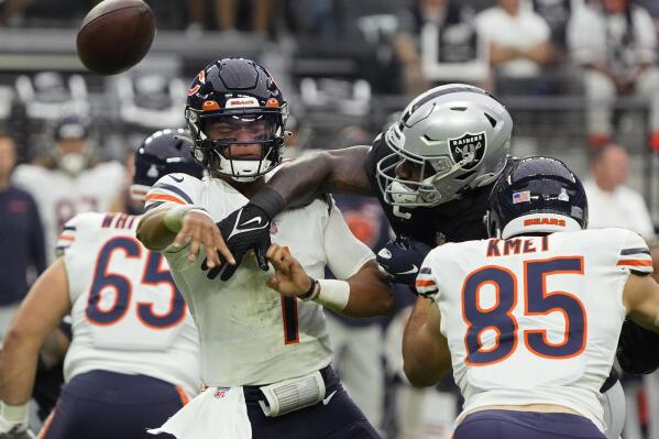 Las Vegas Raiders defensive end Yannick Ngakoue (91) breaks up a pass attempt by Chicago Bears quarterback Justin Fields (1) during the first half of an NFL football game, Sunday, Oct. 10, 2021, in Las Vegas. (AP Photo/Rick Scuteri)