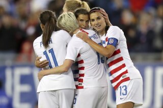 
              United States' Tobin Heath, second from right, is congratulated on her goal by Mallory Pugh (11), Megan Rapinoe and Alex Morgan (13) during the first half of a SheBelieves Cup soccer match against Brazil Tuesday, March 5, 2019, in Tampa, Fla. (AP Photo/Mike Carlson)
            