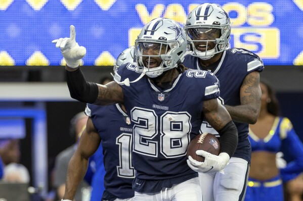 FILE- Dallas Cowboys' Malik Hooker celebrates after an interception against the Los Angeles Rams during an NFL football game, Sunday, Oct. 9, 2022, in Inglewood, Calif. The Dallas Cowboys and safety Malik Hooker agreed Saturday, Aug. 5, 2023, on a $24 million, three-year contract extension. (AP Photo/Jeff Lewis, File)