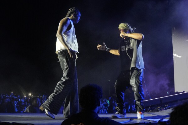 Young Thug, left, performs with special guest T.I. during the Summer Smash Music Festival on Sunday, June 22, 2025, in Bridgeview, Ill. (Photo by Rob Grabowski/Invision/AP)