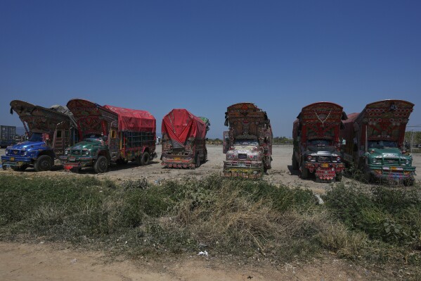 Trucks decorated with artwork are parked at a terminal on the outskirts of Islamabad, Pakistan, on Sunday, April 27, 2025. (AP Photo/Anjum Naveed)