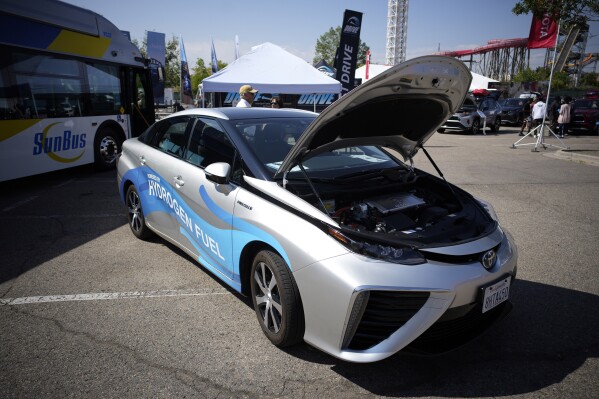 FILE - A 2021 Toyota Prius that runs on a hydrogen fuel cell sits on display at the Denver auto show on Sept. 17, 2021, at Elitch's Gardens in downtown Denver. The White House is set to announce that it has selected the Philadelphia area and West Virginia for two regional hubs to produce and deliver hydrogen fuel, a key part of its clean energy plan, according to a person familiar with the plan. (AP Photo/David Zalubowski, File)