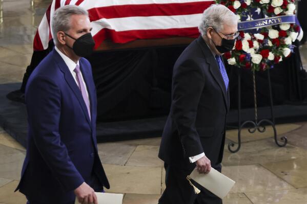 House Minority Leader Kevin McCarthy of Calif. and Senate Minority Leader Mitch McConnell of Ky., right, pay their respects to former Senate Majority Leader Harry Reid, D-Nev., during a memorial service in the Rotunda of the U.S. Capitol as Reid lies in state, Wednesday, Jan. 12, 2022, in Washington.  (Evelyn Hockstein/Pool via AP)