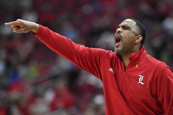 Louisville interim head coach Mike Pegues shouts instructions to his team during the second half of an NCAA college basketball game against Miami in Louisville, Ky., Wednesday, Feb. 16, 2022. Miami won 70-63. (AP Photo/Timothy D. Easley)