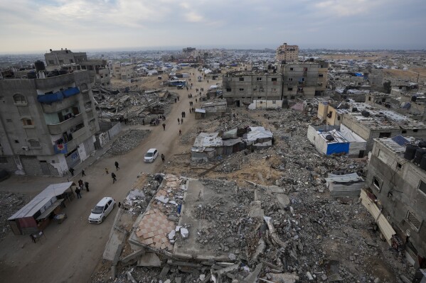 A tent camp for displaced Palestinians is set up amid destroyed buildings in the Khan Younis refugee camp, southern Gaza Strip, Jan. 4, 2025. (AP Photo/Abdel Kareem Hana, File)