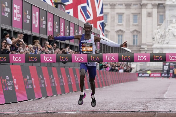 FILE - Kenya's Kelvin Kiptum crosses the finish line to win the men's race at the London Marathon in London, April 23, 2023. World record-holder Kiptum was supposed to race in the Netherlands this weekend, with plans to attack the flat Rotterdam course in pursuit of the 2-hour barrier. But the 24-year-old Olympic gold-medal favorite died in a one-car accident in his native Kenya in Feb. 2024, leaving a void in the marathon world. (AP Photo/Alberto Pezzali, File)