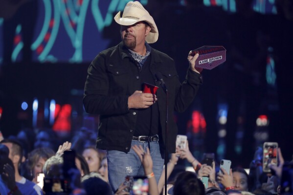 FILE - Toby Keith presents the award for male video of the year at the CMT Music Awards on Wednesday, June 5, 2019, at the Bridgestone Arena in Nashville, Tenn. Keith, the Country music singer-songwriter has died. A statement posted on his website says Keith, who was battling stomach cancer, died peacefully Monday, Feb. 5, 2024 surrounded by his family. (AP Photo/Mark Humphrey, File)