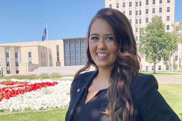 Cara Mund poses for a photo in front of the state Capitol in Bismarck, N.D. on Wednesday, Aug. 10, 2022. The former Miss America Mund says her concern about abortion rights prompted her to launch her independent bid for the U.S. House in her home state. Mund would face an uphill battle in deeply conservative North Dakota, but told The Associated Press that the U.S. Supreme Court's ruling to overturn a constitutional right to abortion was "just a moment where I knew we need more women in office." (AP Photo/James MacPherson)