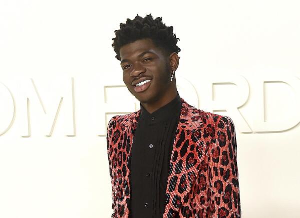FILE - Lil Nas X attends the Tom Ford show at Milk Studios during NYFW Fall/Winter 2020 on Feb. 7, 2020, in Los Angeles. The rapper has been awarded the inaugural Suicide Prevention Advocate of the Year Award from the advocacy group The Trevor Project. The Trevor Project is a nonprofit dedicated to suicide prevention and crisis intervention for lesbian, gay, bisexual, transgender, queer and questioning young people. (Photo by Jordan Strauss/Invision/AP, File)