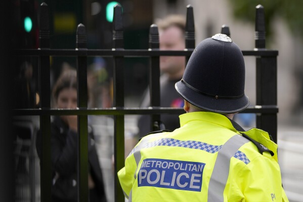 FILE - A view of a Metropolitan police officer on patrol, in London, on Oct. 1, 2021. London’s police force says that over 1,000 officers are currently suspended or on restricted duties as the department steps up efforts to root out bad cops following a scathing report that found it was institutionally racist, homophobic and misogynistic in a statement released on Tuesday Sept. 19, 2023. (AP Photo/Frank Augstein, File)