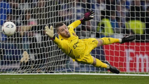 FILE - Manchester United's goalkeeper David de Gea attempts to save a penalty in a shootout 3during the English FA Cup semifinal between Manchester United and Brighton and Hove Albion at Wembley Stadium in London, Sunday, April 23, 2023. Veteran goalkeeper David de Gea has announced he is leaving Manchester United as a free agent after 12 seasons at Old Trafford. The 32-year-old's contract with United expired at the end of June, with no new deal agreed despite talks that took place throughout the season. (AP Photo/Alastair Grant, File)