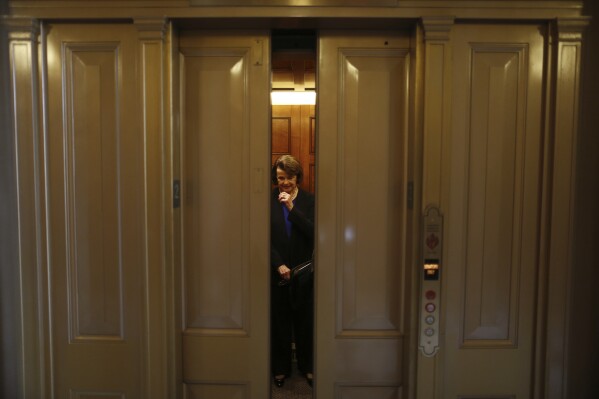 FILE - U.S. Sen. Dianne Feinstein, D-Calif., is seen in an elevator on Capitol Hill in Washington, Wednesday, April 17, 2013, after speaking on the Senate floor about gun legislation. A bipartisan effort to expand background checks was in deep trouble as the Senate approached a long-awaited vote on the linchpin of the drive to curb gun violence. (AP Photo/Charles Dharapak, File)