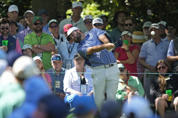 Scottie Scheffler hits his tee shot on the seventh hole during second round at the Masters golf tournament at Augusta National Golf Club Friday, April 12, 2024, in Augusta, Ga. (AP Photo/Matt Slocum)