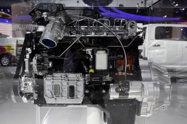 FILE - A 6.7L Cummins Diesel engine is displayed at the Ram booth during the media preview of the Chicago Auto Show at McCormick Place in Chicago on Thursday, Feb. 6, 2014. Engine manufacturer Cummins Inc. has agreed to pay an over $1.67 billion penalty to settle regulatory claims that the company unlawfully altered hundreds of thousands of pickup truck engines to bypass emissions tests. (AP photo/Nam Y. Huh, File)