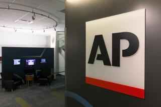 FILE - The Associated Press logo appears on April 26, 2016, in New York. The AP said Monday, May 24, 2021, that it will seek staff input and review its social media policies following last week's firing of a journalist who had expressed pro-Palestinian views. The move came after more than 100 journalists signed an open letter expressing concerns about the firing of the journalist roughly two weeks after she joined the AP. (AP Photo/Hiro Komae, File)