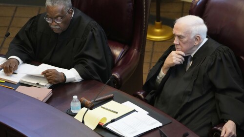 Mississippi Supreme Court Presiding Justices Leslie D. King, left, and James W. Kitchens, listen as lawyers argue over the constitutionality of a Mississippi law that would authorize some judges who would be appointed in a state where most judges are elected, Thursday, July 6, 2023, before the state supreme court in Jackson, Miss. (AP Photo/Rogelio V. Solis)