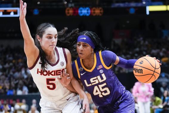 LSU's Alexis Morris drives past Virginia Tech's Georgia Amoore during the first half of an NCAA Women's Final Four semifinals basketball game Friday, March 31, 2023, in Dallas. (AP Photo/Tony Gutierrez)