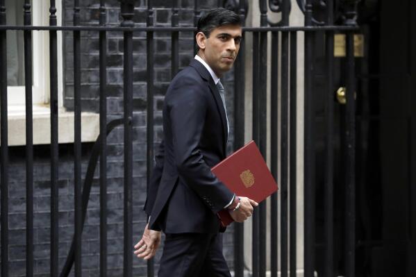 FILE - In this Wednesday, July 8, 2020 file photo, British Chancellor of the Exchequer Rishi Sunak leaves number 11 Downing Street, to deliver a financial announcement to the Houses of Parliament in London. Finance ministers from the Group of Seven wealthy democracies have a lot to talk about when they gather in London starting Friday, June 4, 2021. Ministers at the meeting chaired by Britain's Rishi Sunak and to be attended by U.S. Treasury Secretary Janet Yellen will talk about supporting the post-pandemic economic recovery and work on restoring cooperation among the seven allies after friction during the term of former President Donald Trump. (AP Photo/Matt Dunham, File)