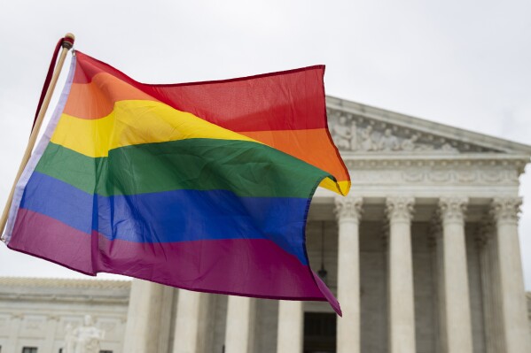 A pride flag is seen in front of the U.S. Supreme Court, Oct. 8, 2019, in Washington. (AP Photo/Manuel Balce Ceneta, File)