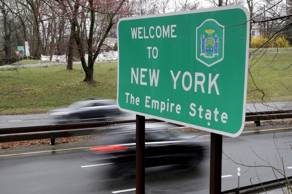 FILE — A sign welcomes motorists to New York, on the border with Connecticut, near Rye Brook, N.Y., March 29, 2020. A federal appeals court has ruled, Friday, April 26, 2024, that New York can move ahead with a law requiring internet service providers to offer heavily discounted rates to low-income residents. (AP Photo/Seth Wenig, File)