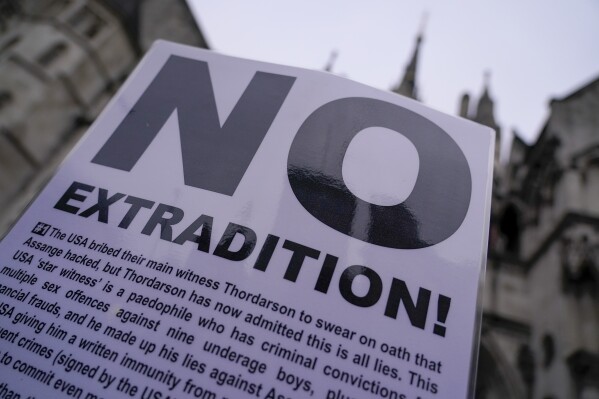 A banner is left outside the Royal Courts of Justice in London on Tuesday, February 20, 2024.  WikiLeaks founder Julian Assange will make his final appeal in court against his impending extradition to the United States.  (AP Photo/Alberto Pezzali)