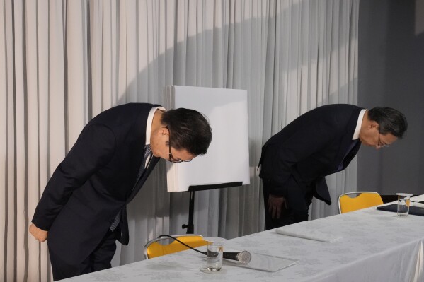Tomihiro Tanaka, left, President of Family Federation for World Peace and Unification, and its senior member Hideyuki Teshigawara bow at the start of a press conference Tuesday, Nov. 7, 2023, in Tokyo. The church has criticized the Japanese government’s request for a court order to dissolve the group, saying it’s based on groundless accusations and is a serious threat to religious freedom and human rights of its followers. Japan’s Education Ministry last month asked the Tokyo District Court to revoke the legal status of the Unification Church after a ministry investigation concluded the group for decades has systematically manipulated its followers into donating money, sowing fear and harming their families.(AP Photo/Shuji Kajiyama)