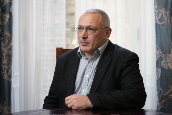 FILE - Exiled Russian businessman and opposition figure Mikhail Khodorkovsky poses during an interview in London, Tuesday, Jan. 16, 2024. An Amsterdam court on Tuesday rejected Russia's final argument in a years-long legal battle over a $50 billion arbitration award that is centered on claims by former shareholders that the Kremlin deliberately bankrupted Russian oil giant Yukos to silence its CEO, a fierce critic of President Vladimir Putin. CEO Mikhail Khodorkovsky was arrested at gunpoint in 2003 and spent more than a decade in prison as Yukos’ main assets were sold to a state-owned company. Yukos ultimately went bankrupt. (AP Photo/Kin Cheung, File)