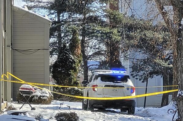 Police tape cordons off a driveway on Dec. 26, 2022, in Des Moines, Iowa, where police fatally shot a 16-year-old who they said pointed a gun at them. (Bill Steiden/The Des Moines Register via AP)