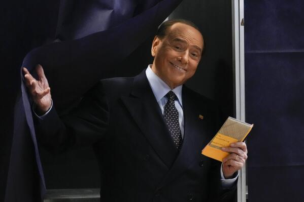 FILE - Silvio Berlusconi, leader of center-right, populist Forza Italia comes out of a voting booth before casting his ballot at a polling station in Milan, Italy, Sunday, Sept. 25, 2022. Doctors for Italian former Premier Silvio Berlusconi say he is being treated in hospital for a lung infection that is a result of chronic leukemia. Berlusconi’s personal physician, Alberto Zangrillo, signed off on a medical bulletin issued Thursday, April 6, 2023 afternoon that said Berlusconi “has had for some time” leukemia in a “persistent chronic phase.” (AP Photo/Antonio Calanni, File )