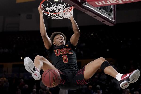 Southern California guard Boogie Ellis (0) dunks during the final seconds of the second half of an NCAA college basketball game against Arizona State, Thursday, Feb. 3, 2022, in Tempe, Ariz. Southern California defeated Arizona State 58-53. (AP Photo/Matt York)