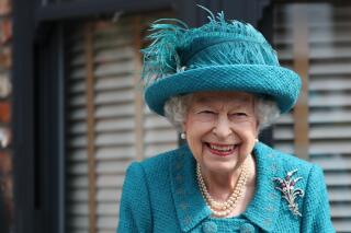 FILE - In this Thursday July 8, 2021 file photo, Britain's Queen Elizabeth visits the set of the long running television series Coronation Street, in Manchester, England.  Queen Elizabeth II and the Royal Family back the Black Lives Matter movement, one of her senior representatives has said in a television interview to be broadcast later Friday, Sept. 10. (AP Photo/Scott Heppell, file)