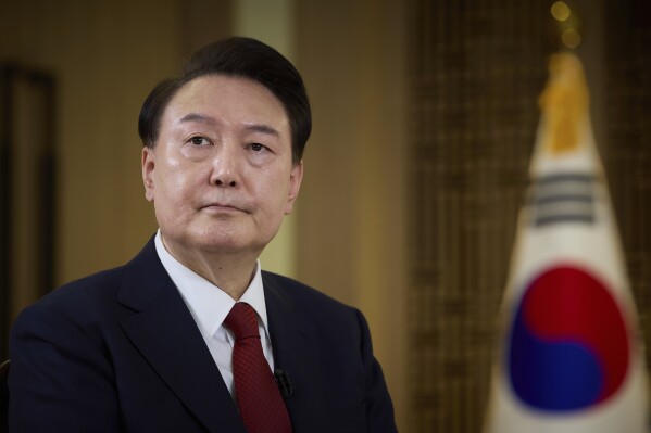 In this photo provided on Wednesday, Feb. 7, 2024 by the South Korea Presidential Office, South Korean President Yoon Suk Yeol speaks during a pre-recorded interview with KBS television at the presidential office in Seoul, South Korea, Sunday, Feb. 4, 2024. Yoon reiterated that the country would not seek its own nuclear deterrent in the face of threats from nuclear-armed North Korea as he vowed further efforts to sharpen nuclear deterrence strategies with ally United States. (South Korea Presidential Office via AP)