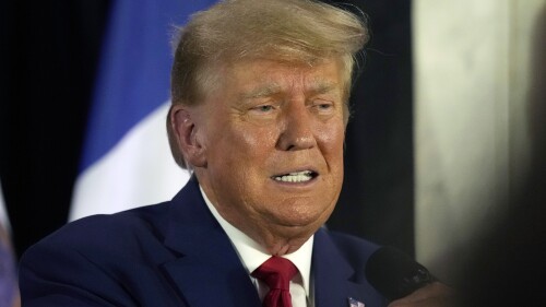 CORRECTS CIITY AND LOCATION - Former President Donald Trump visits with campaign volunteers at the Elks Lodge Tuesday, July 18, 2023, in Cedar Rapids, Iowa. (AP Photo/Charlie Neibergall)