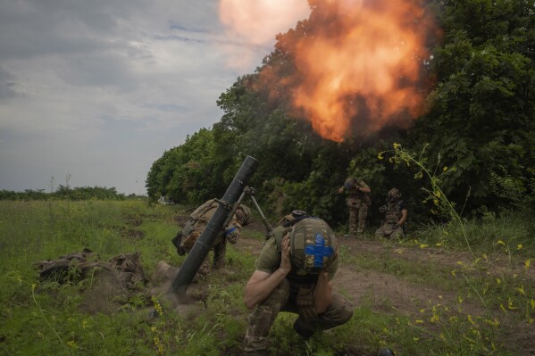 Ukrainian soldiers fire towards Russian positions on the frontline in Zaporizhzhia region, Ukraine, Saturday, June 24, 2023. (AP Photo/Efrem Lukatsky)
