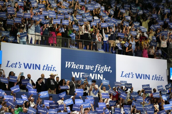 FILE - The crowd responds as Vice President Kamala Harris arrives to speak during a campaign rally, July 30, 2024, in Atlanta. Harris and former President Donald Trump held dueling Georgia rallies four days apart, but the dynamics showcased how deeply divided the American electorate is. The Harris crowd was majority Black and female. Trump's crowd was overwhelmingly white. They listened to different music. They heard wildly different arguments on immigration, the economy, voting rights. Either Harris or Trump will win. The question is how widely the winner will be accepted. (AP Photo/John Bazemore, File)